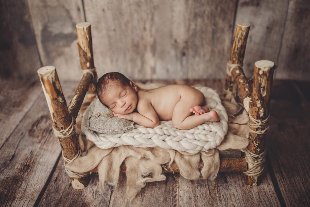 Kansas City Newborn Photography on prop